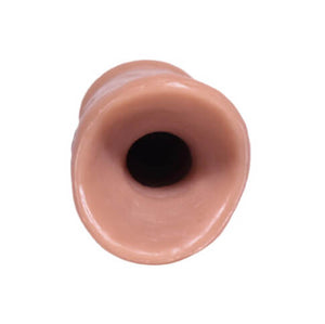 Hole of bottom side of the 002 skin tone of the PeenPocket pleasure sleeve for transgender men.