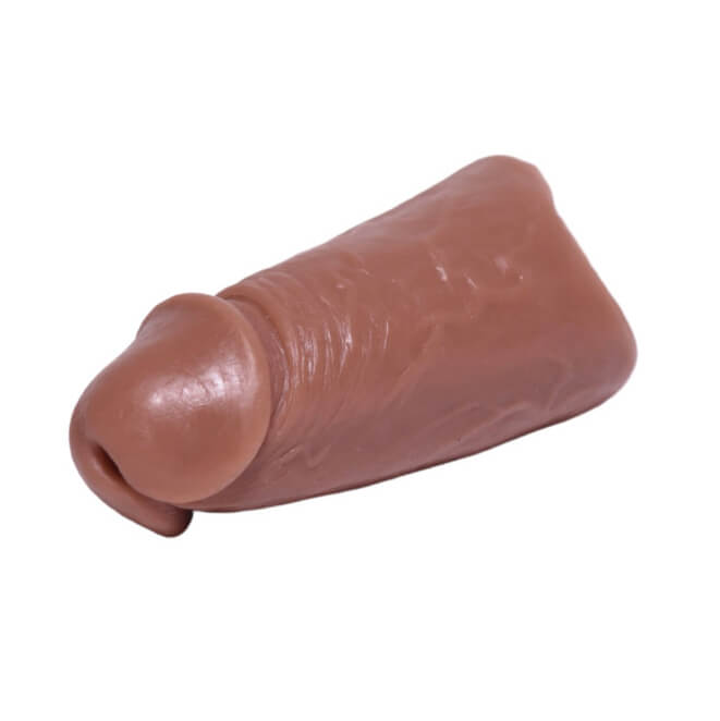 Left side of the 003 skin tone of the PeenPocket pleasure sleeve for transgender men.