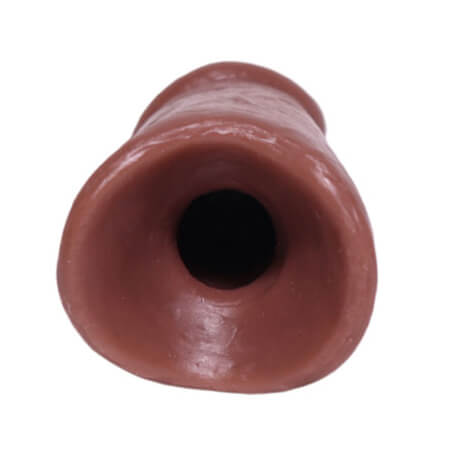 Bottom hole of the 004 skin tone of the PeenPocket pleasure sleeve for transgender men.