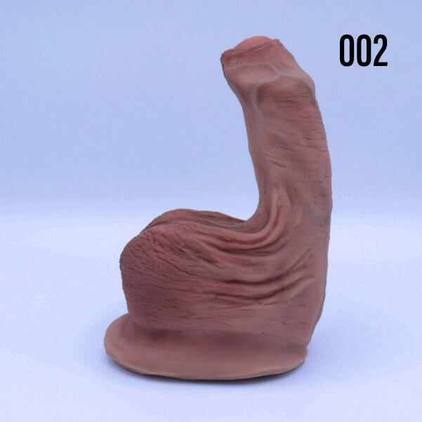 Left side of the 001 Painted Uncut Jimmy STP stand to pee packer for trans men.