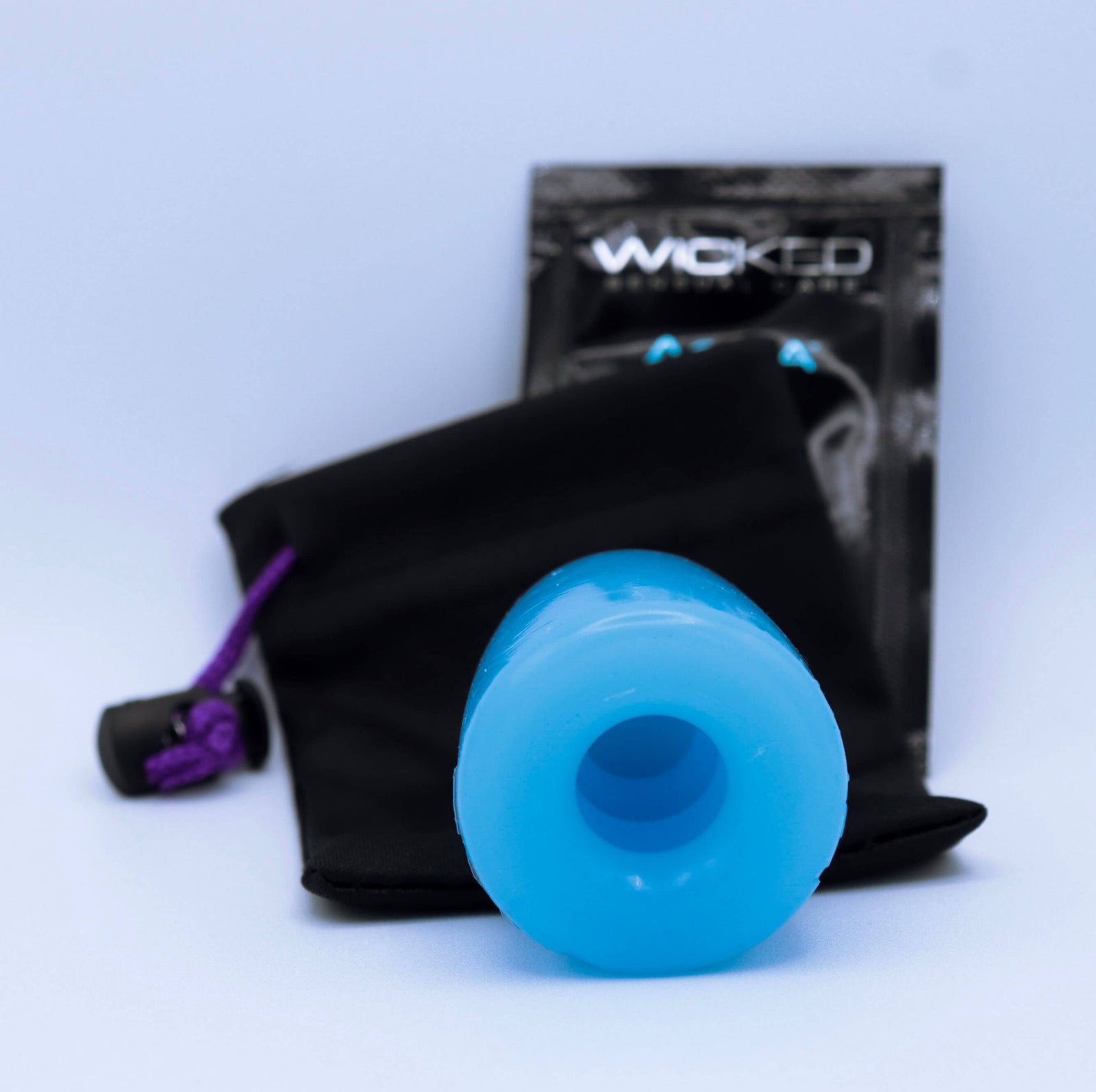 A close up photo of the top of the ShotPocket pleasure sleeve, showing it is round and blue.