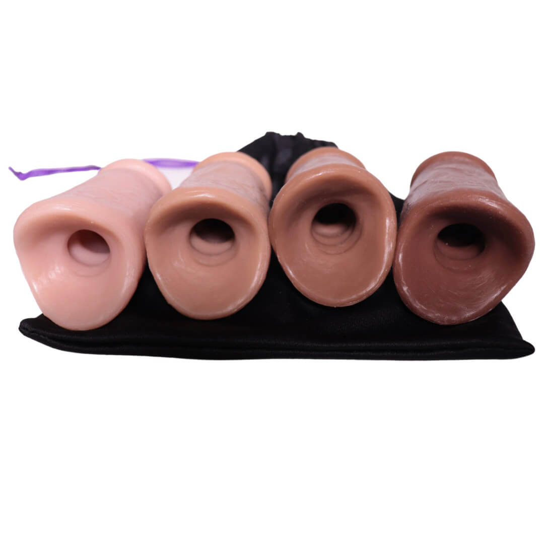 The back of all four skin tones of the PeenPocket pleasure sleeve for trans men.