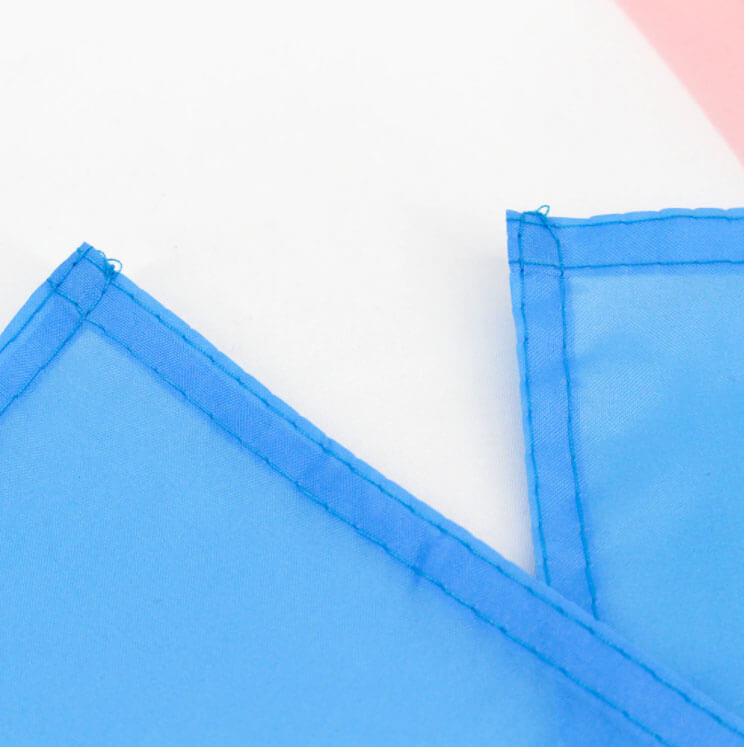 Close up photo of stitching on the trans pride flag.